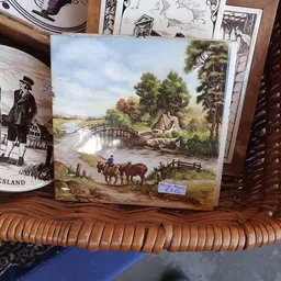 Schilderij van een landelijk tafereel met brug, huisje en man met paard en kar
