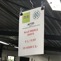 Actiekaart met tekst over DVD's: 'Alle enkele DVD's € 1,- p/st' en '10 voor € 5,-'