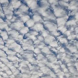 Wolkenvormatie aan de hemel met witte cumulus wolken tegen blauwe lucht