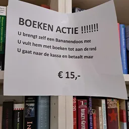 Handgeschreven aankondiging 'Boeken Actie' met instructies en prijs van €15,-