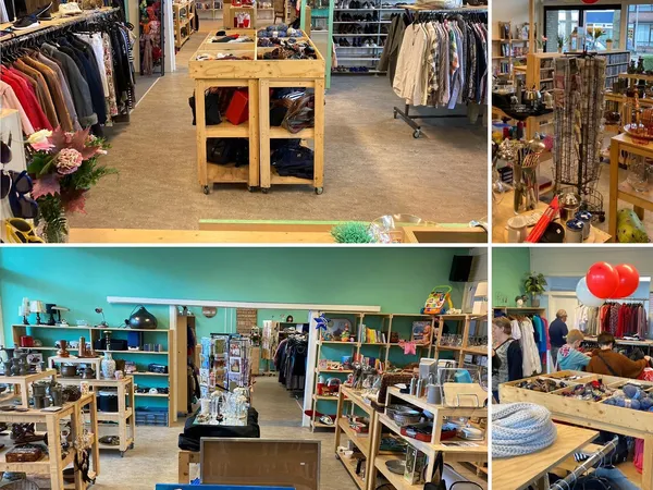 Overzicht van de winkelruimte met kledingrekken, houten display-tafels, stellingen met diverse artikelen en een turquoise-gro