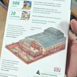 Pagina uit gids met isometrische tekening van gebouw en informatieve tekst