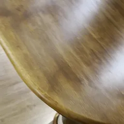 Sterk bewegingsonscherpe close-up van wat lijkt te zijn geel/beige textiel of materiaal