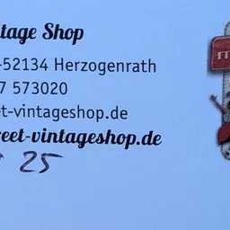 Contactgegevens en website van mainstreet Vintage Shop met logo