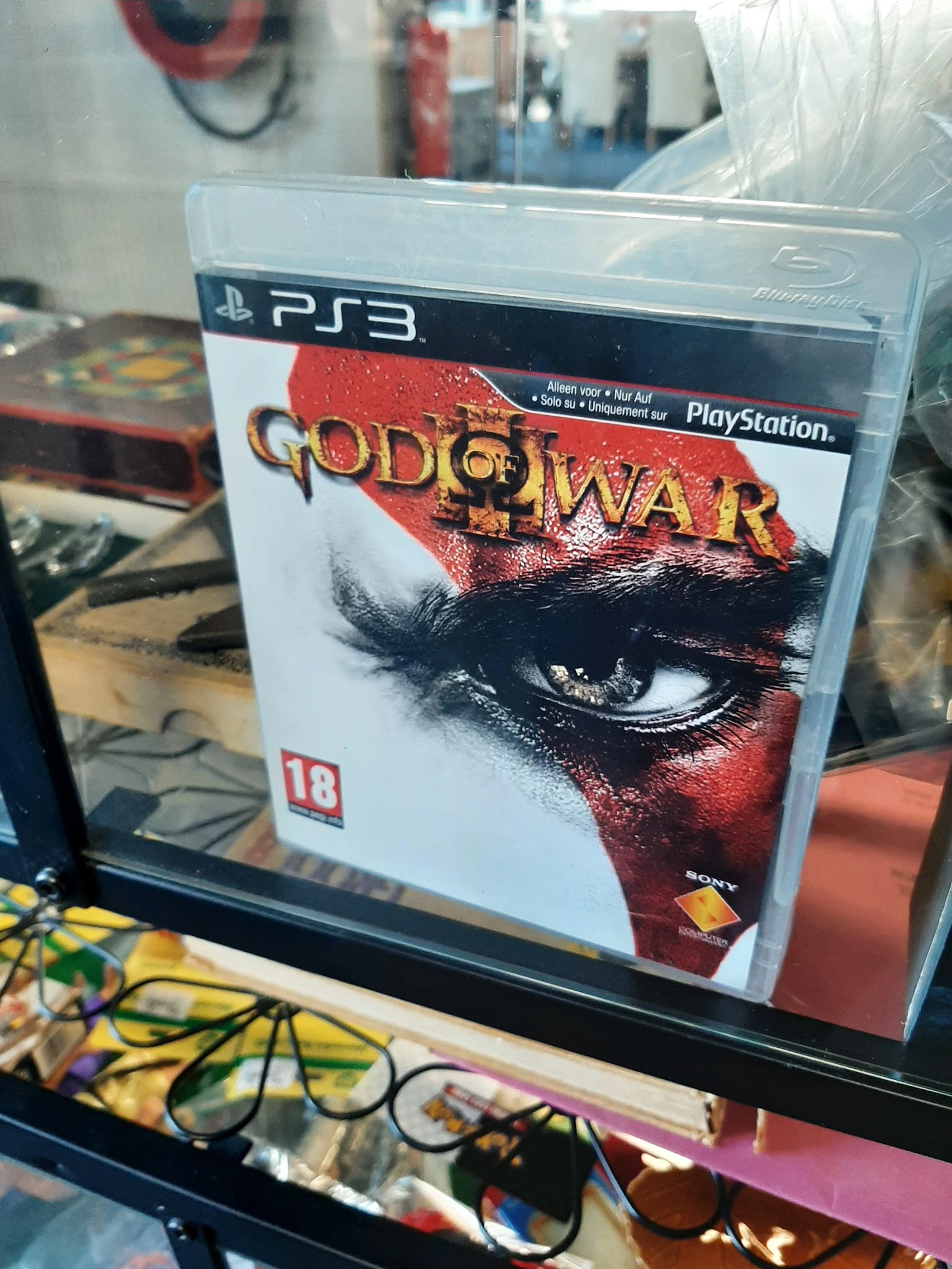 God of War videogame voor PlayStation 3, verpakking met rode en zwarte afbeelding