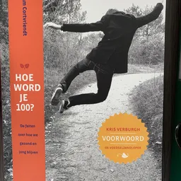 Boekcover met oranje en zwarte elementen en tekst over gezondheid