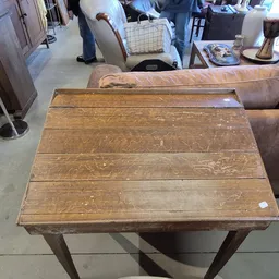Houten uitklapbare eettafel met vier panelen in bruingetinte houtkleur