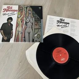 Vinyl LP 'Moot Niet Zeuren!' van Joi Jhansse met hoesje en zwarte plaat op houten ondergrond