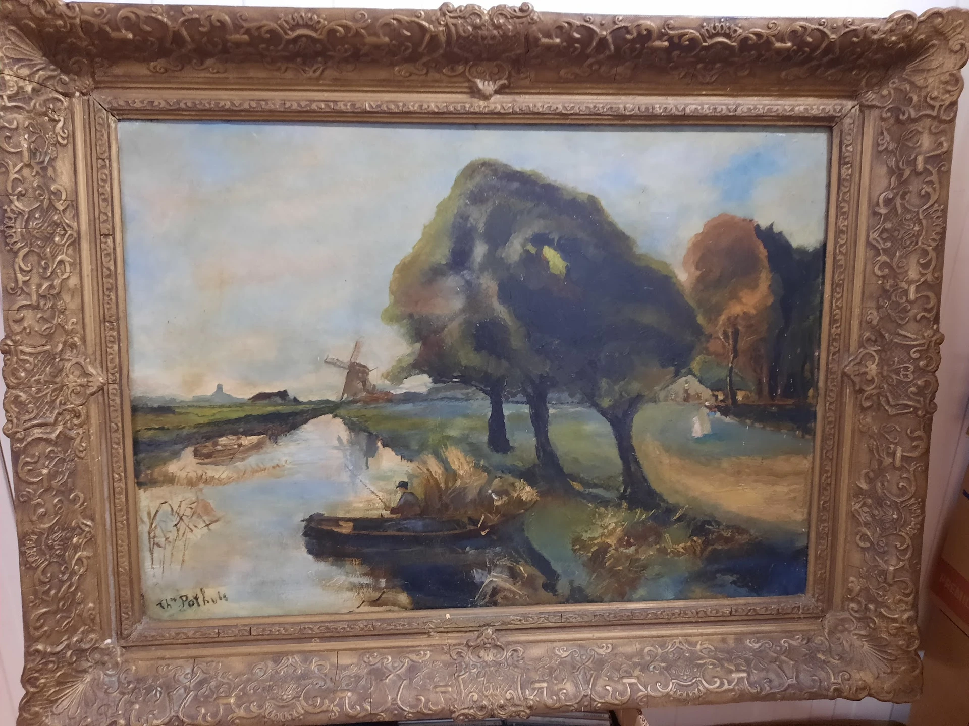 Schilderij in gouden lijst met landschapsmotief: polder met water, bomen en molens