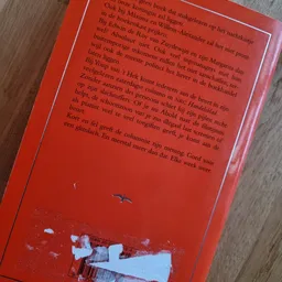 Gedeelte van een rode pagina met Nederlandse tekst